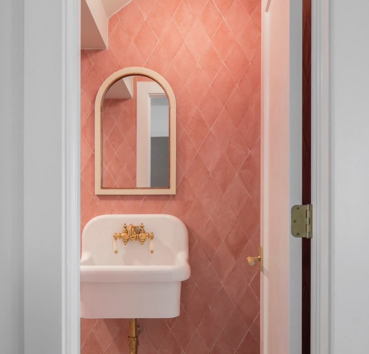 Powder room with pink bathroom tile