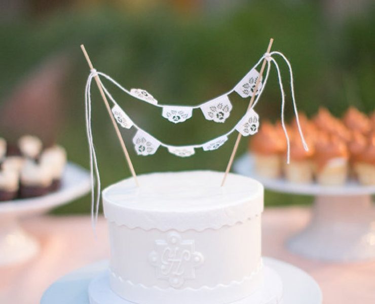 White cake with paper bunting cake topper