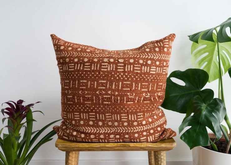 Brown and white patterned throw pillow