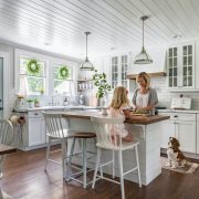 mom and daughter in farmhouse kitchen for Here are a few ways you can make your home both beautiful and functional for the whole family with family friendly decor