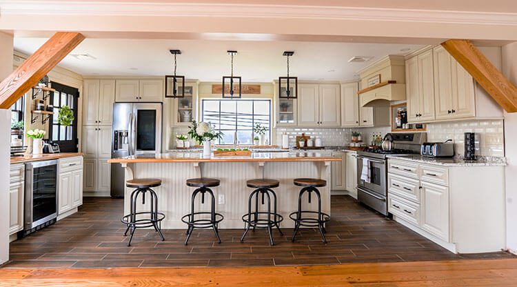 DIY kitchen renovation farmhouse style with white bead board, island and bar stools