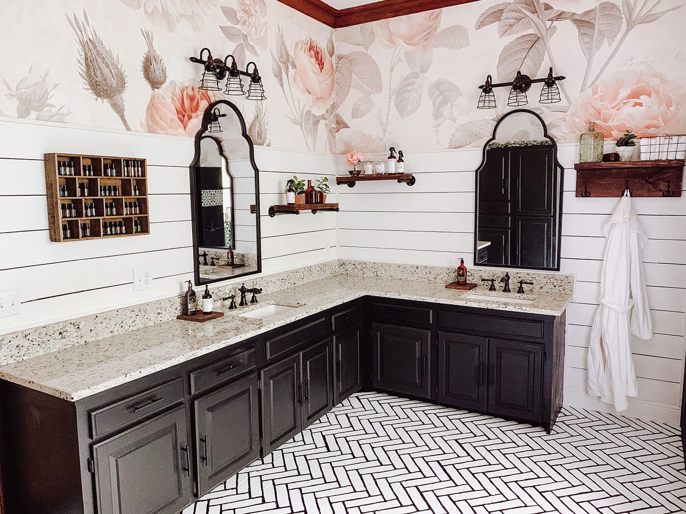 Black cabinets and industrial lighting with shiplap in farmhouse bathroom