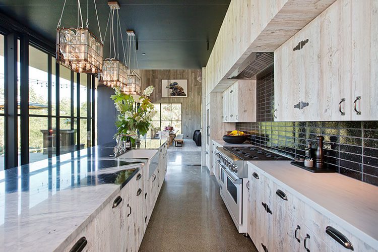 Kitchen with light wood cabinets and black ceiling