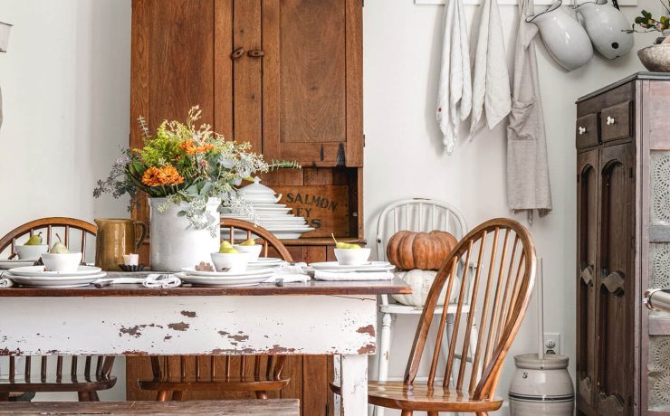 Half of table with chippy paint and fall tablescape