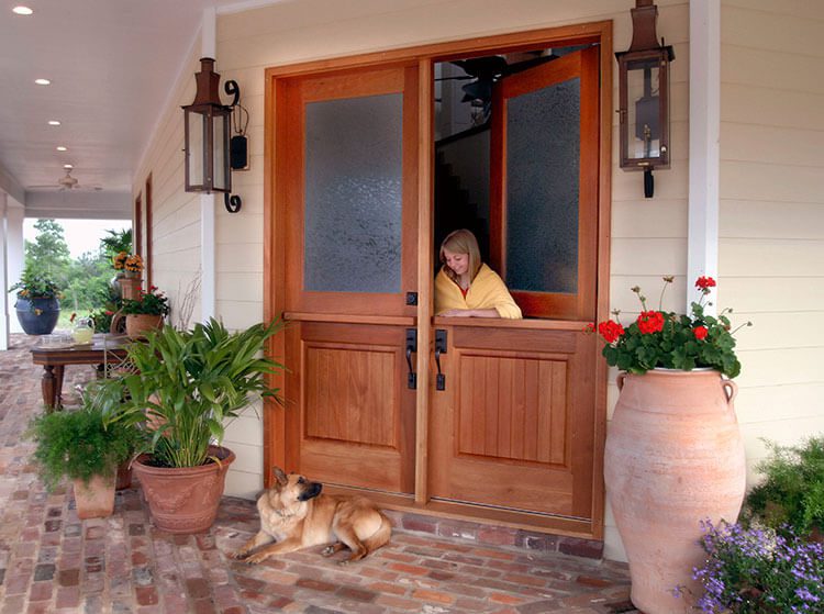 Exterior Dutch doors with girl looking down at dog