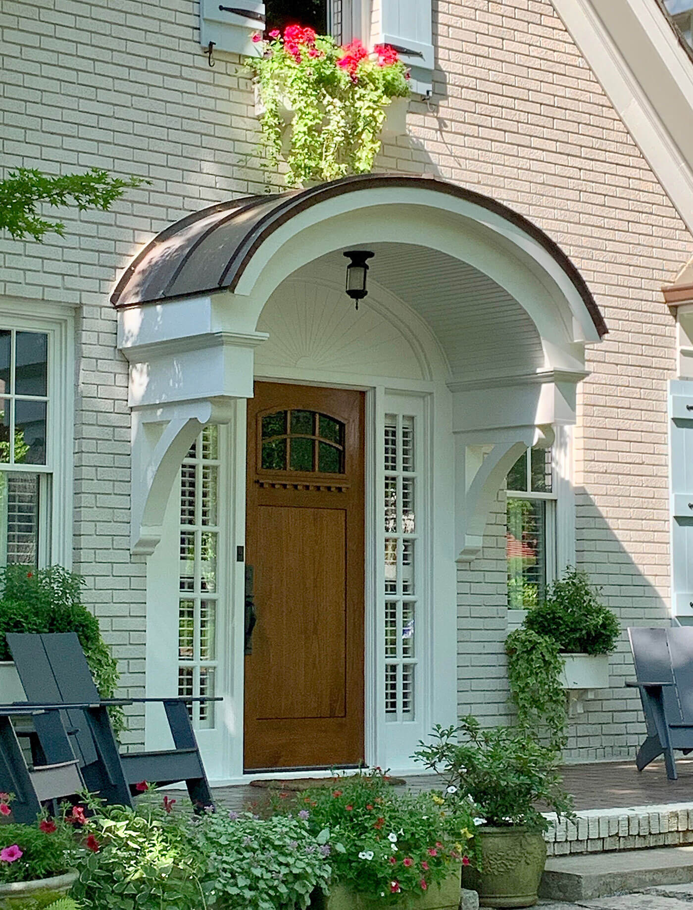 Front door New England home with curved portico