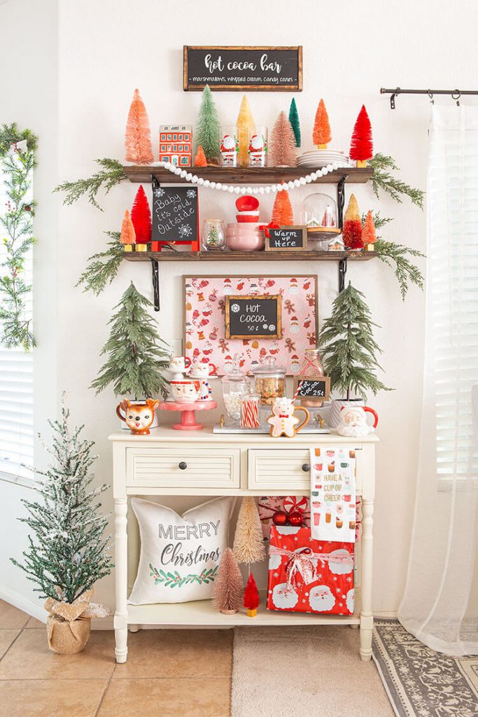 Side table with candy bar and pink and red Christmas decorations