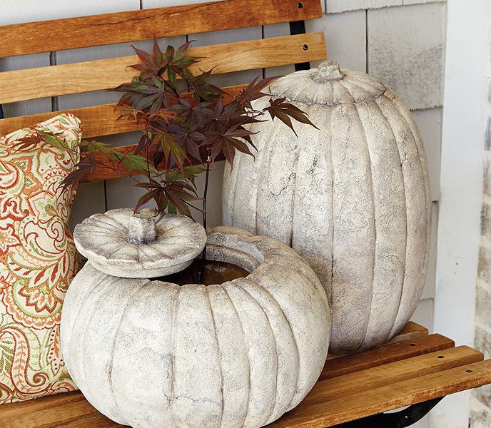Ceramic pumpkin planters on bench