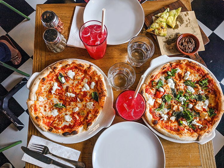 Table top with pizzas and drinks for Labor Day ideas