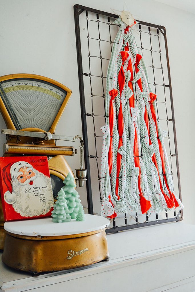 Finished DIY Christmas tree on shelf with vintage Christmas decor next to it