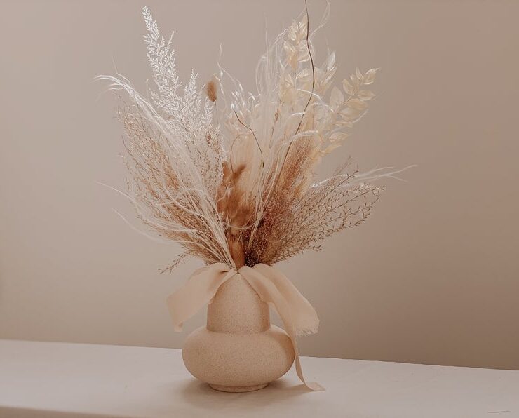 Dried flower bouquet in vase for neutral fall decor