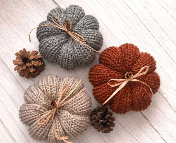knitted pumpkins on a table