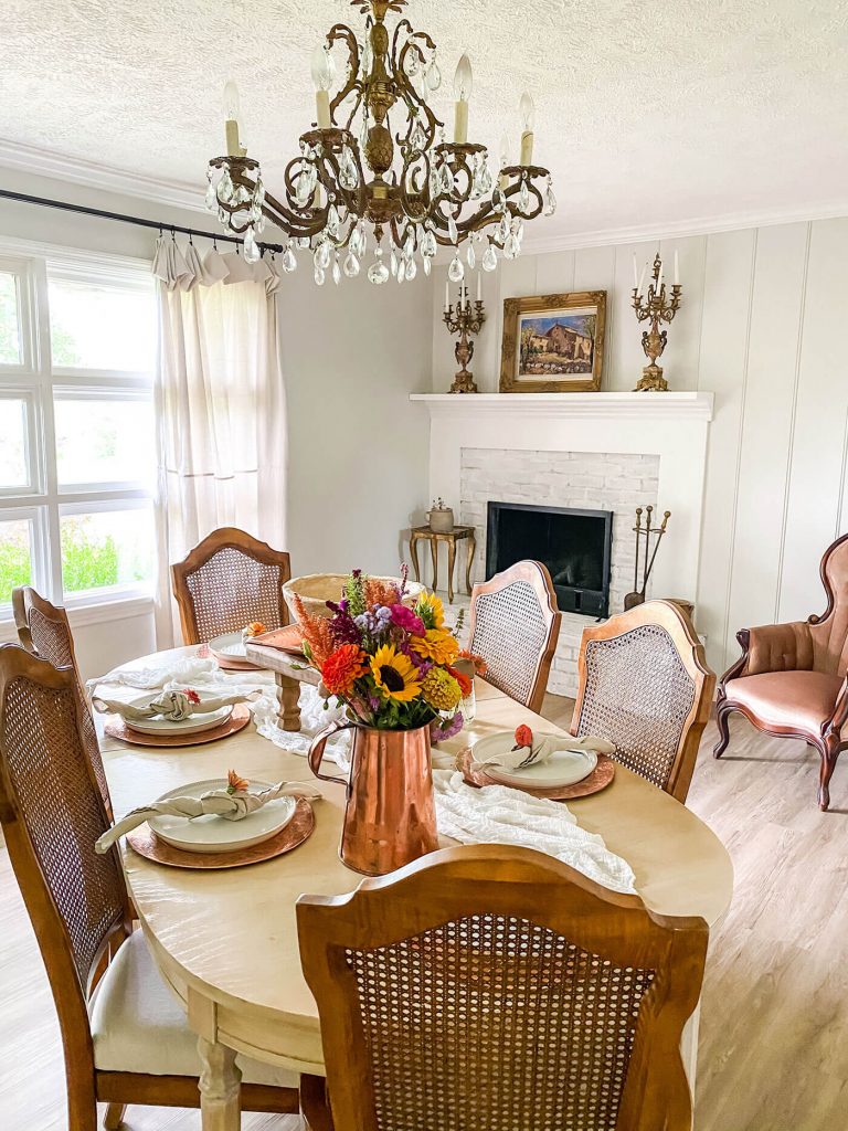 dining room with fall flowers on the table