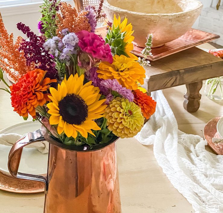 vase of sunflowers and other flowers close up photo for natural fall farmhouse decorating