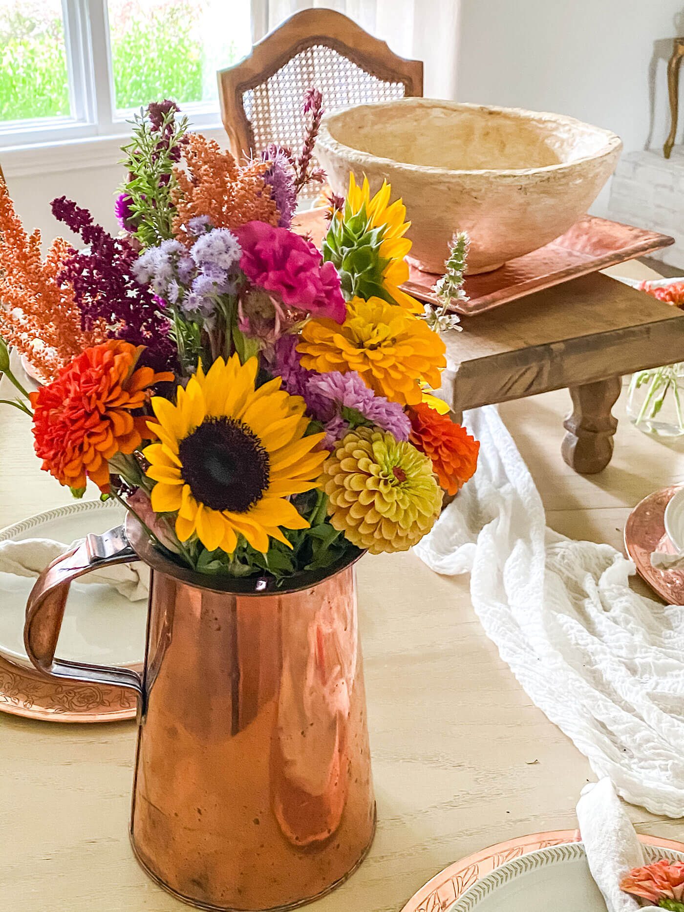 vase of sunflowers and other flowers close up photo for natural fall farmhouse decorating