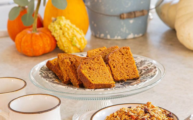 Fall granola close up with pumpkin bread on a plate