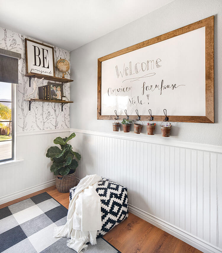 Corner of room with white board and open shelves