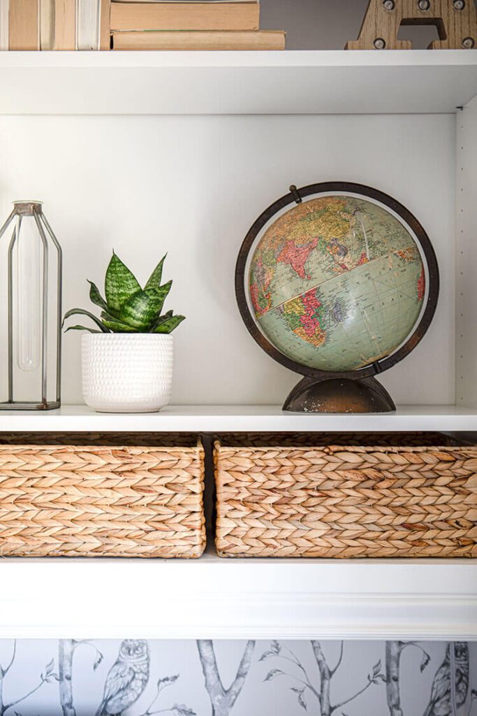 Close up of open shelf with vintage globe