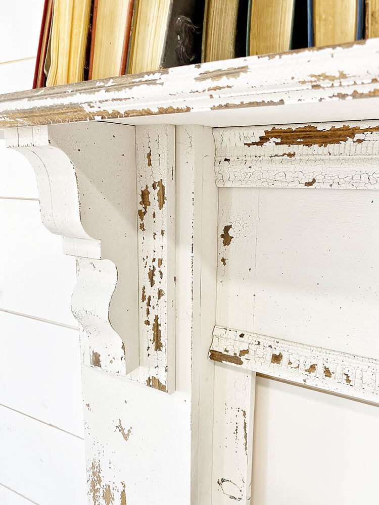 Close up of DIY chippy mantel with flaking paint