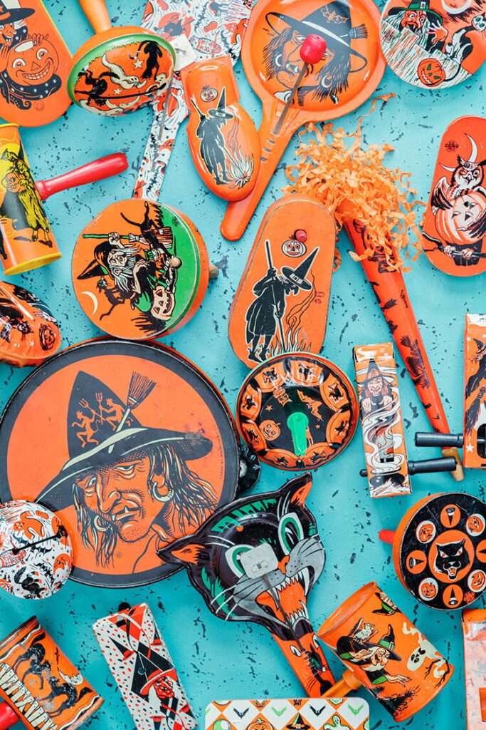 Flatlay with a variety of orange vintage Halloween collectibles