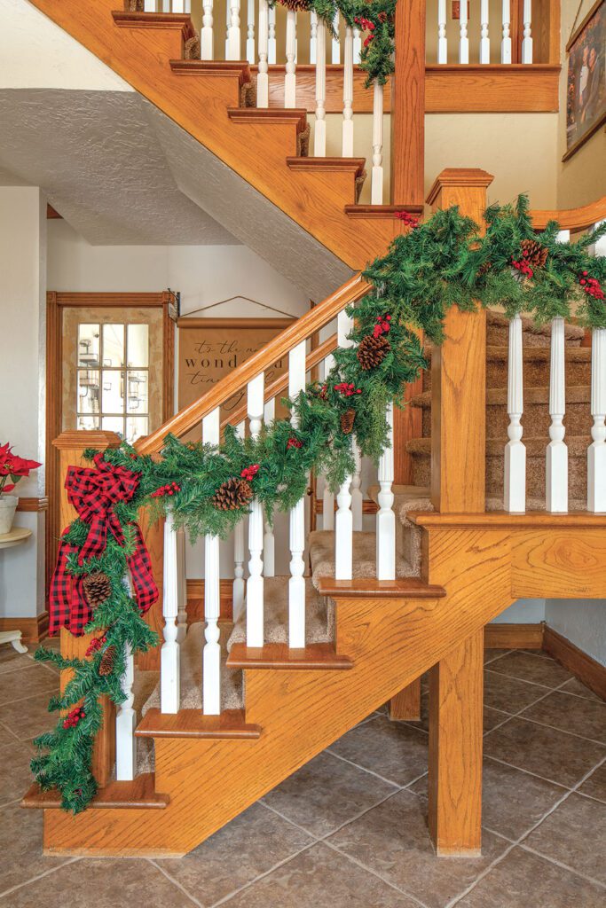 Staircase with Christmas garland and red bow
