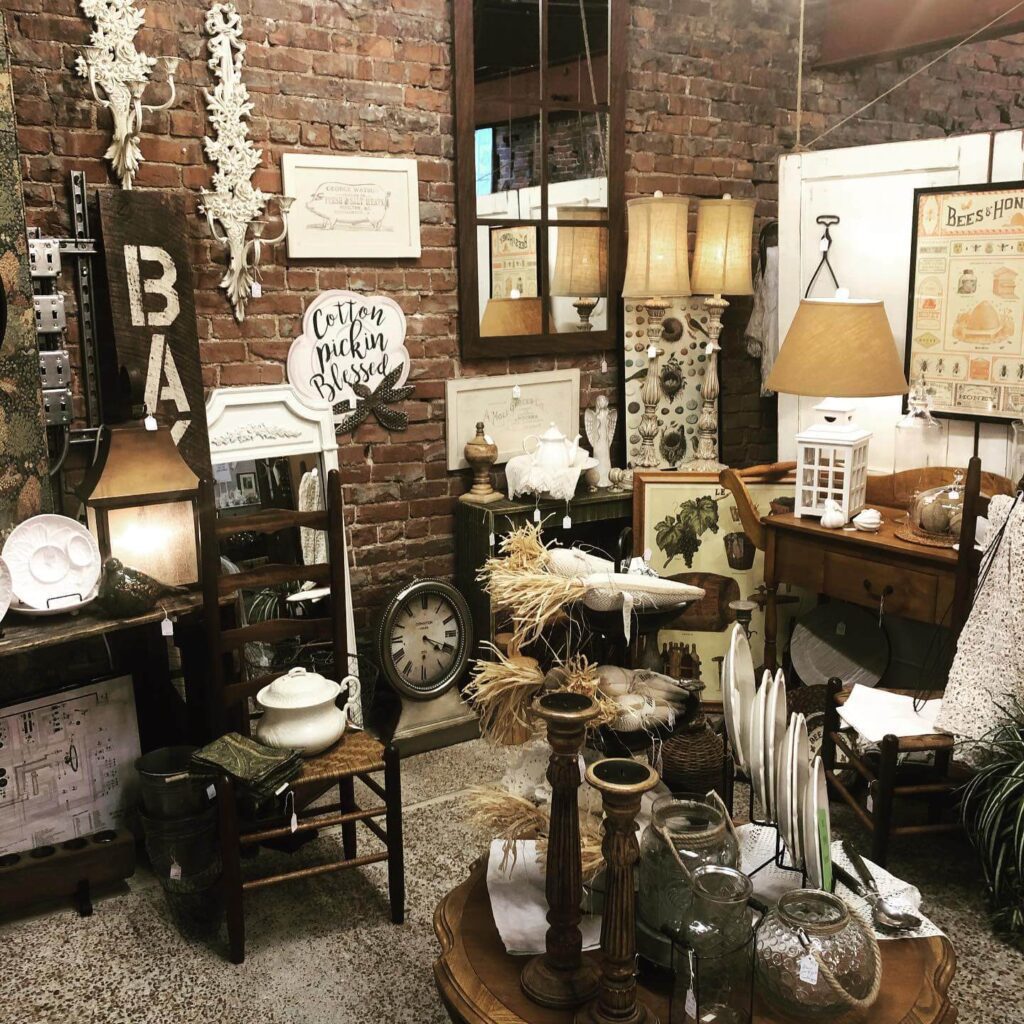 Corner of Antiques Shops with black and white items, old posters, lamp shades and hardware