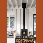 Room with wood burning fireplace and logs stacked plus text