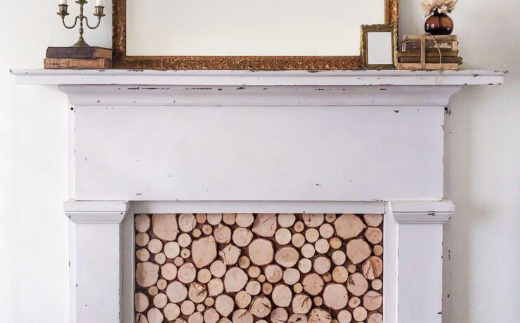 Faux fireplace with wood slice insert and mirror