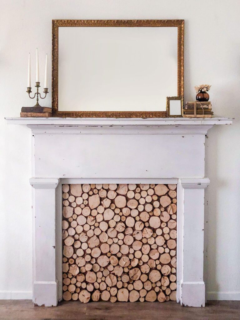 Faux fireplace with wood slice insert and mirror