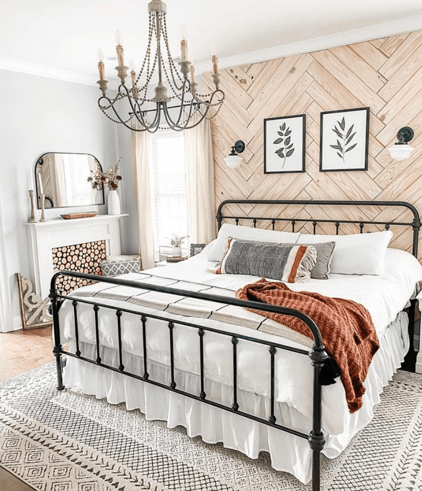 Bedroom with faux fireplace in the corner