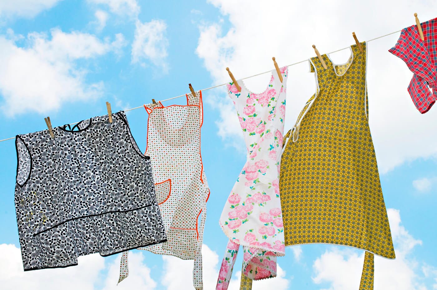 Aprons hanging on clothes line