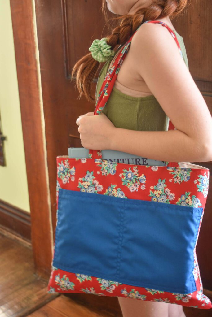 Girl holding book bag