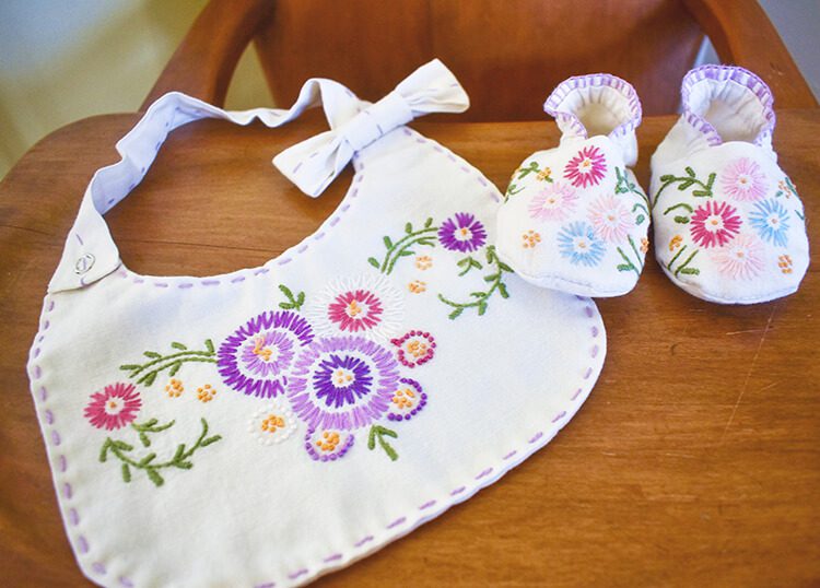 baby booties and bib made from old apron