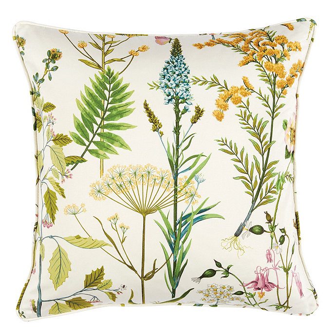 Throw pillow with green, blue and yellow flowers