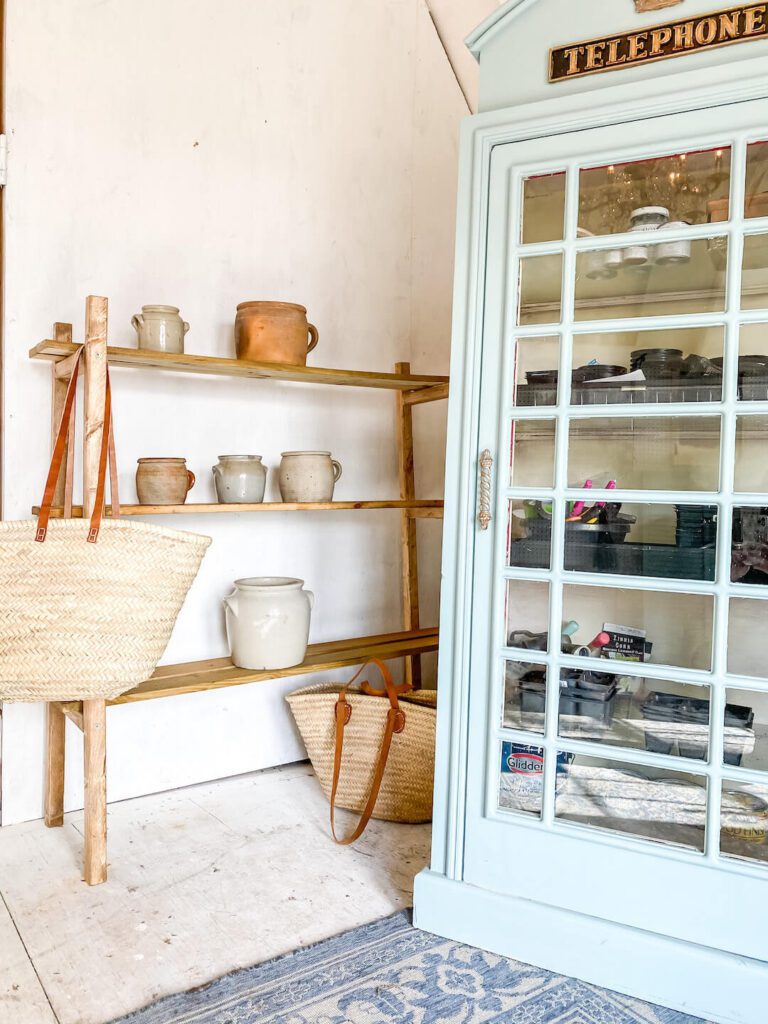 repurposed telephone booth in garden shed