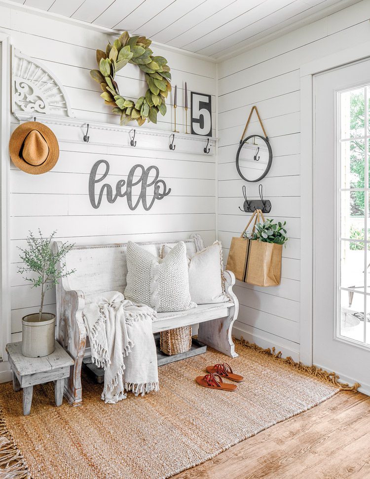 entryway with shiplap and wooden bench