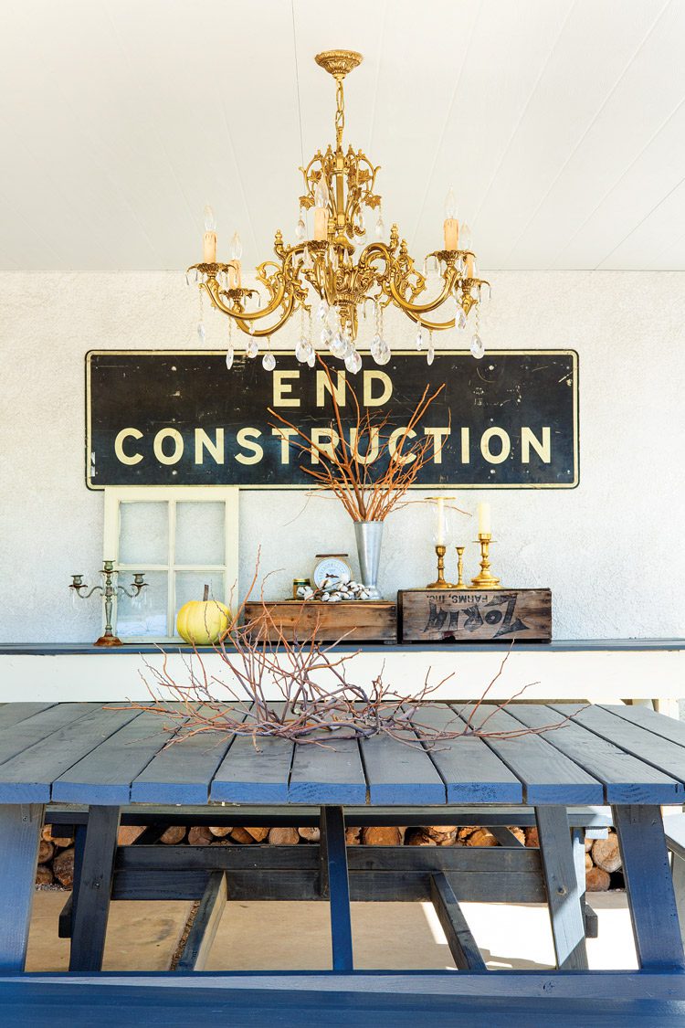 outdoor dining area with chandelier and customized upcycled blue picnic table