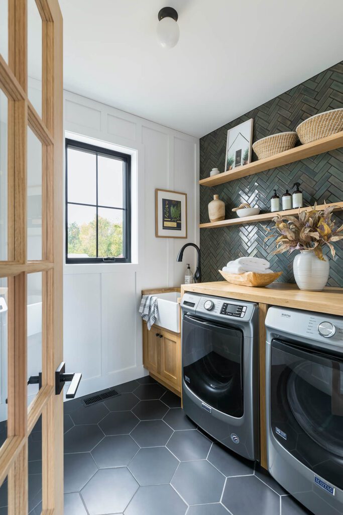 herringbone wall tile and hexagonal floor tile in utility room