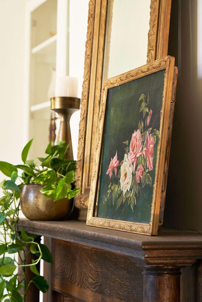 Vintage painting on a mantel for summer decor