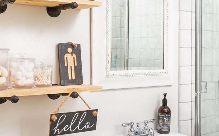Bathroom with open shelves and pedestal sink