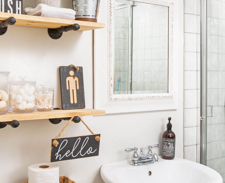 Bathroom with open shelves and pedestal sink