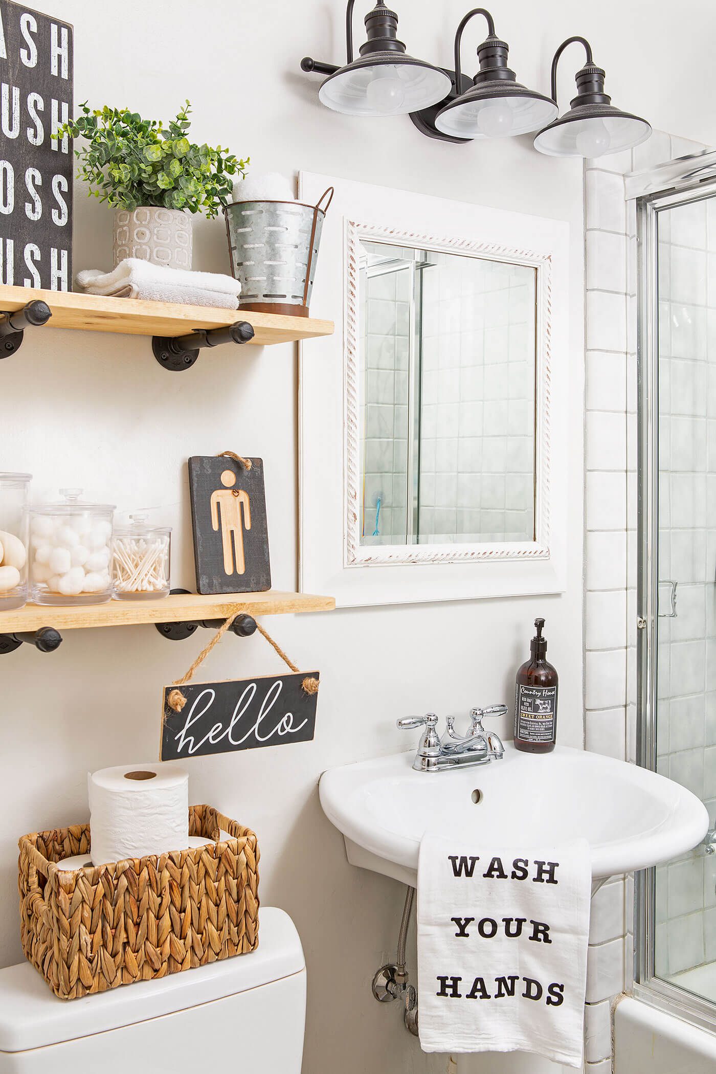 Bathroom with open shelves and pedestal sink