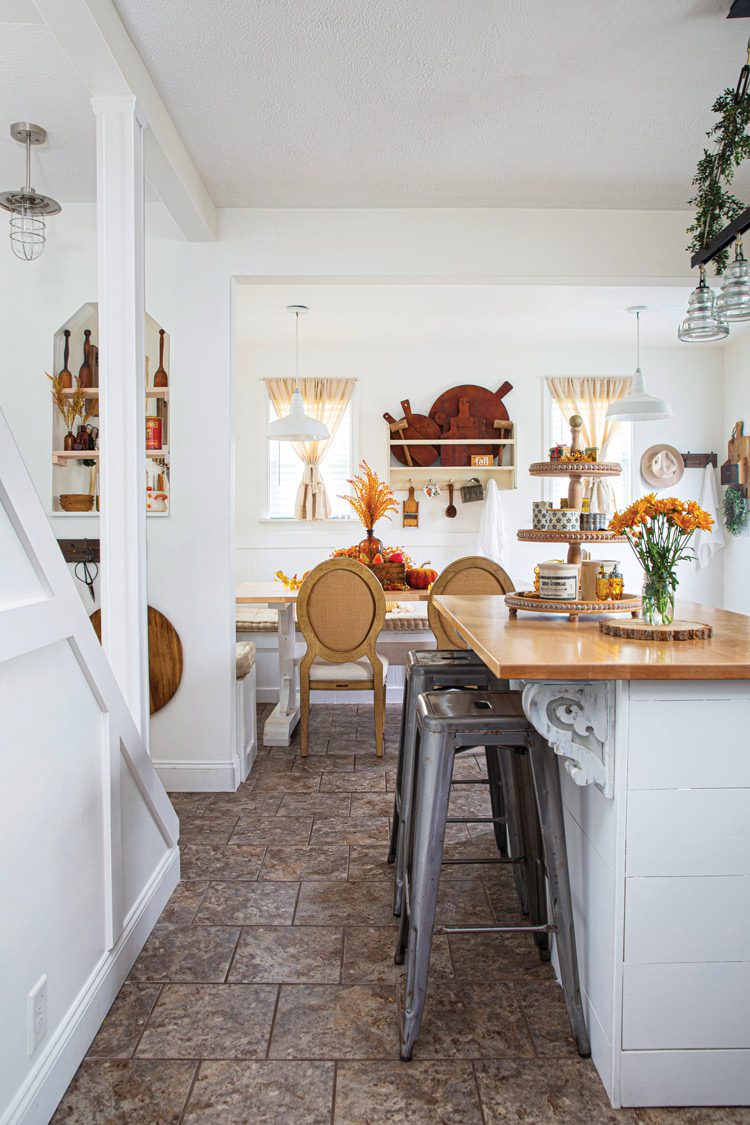 kitchen island and dining table with fall decor