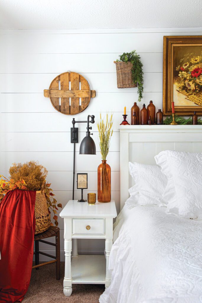 farmhouse master bedroom with wood, vintage and fall color accents