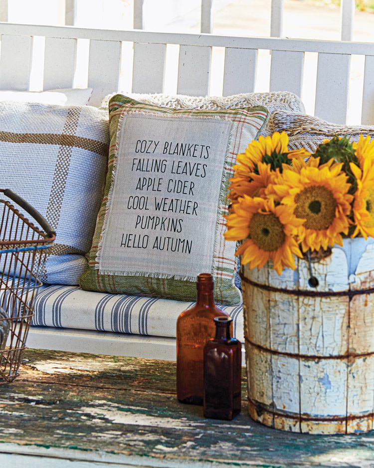 fall porch with sunflowers and throw pillow