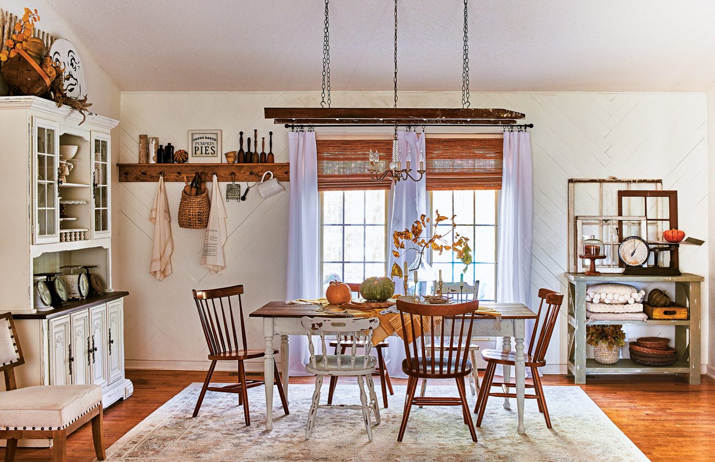 dining room with ladder as lighting fixture