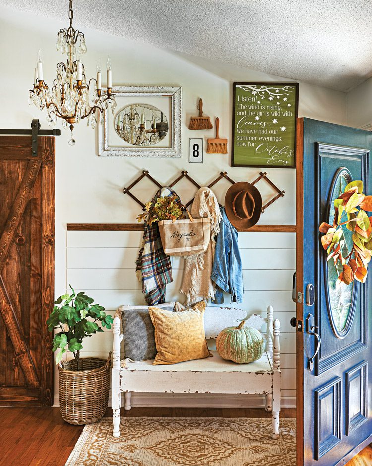 entryway with fall wreath and pumpkin