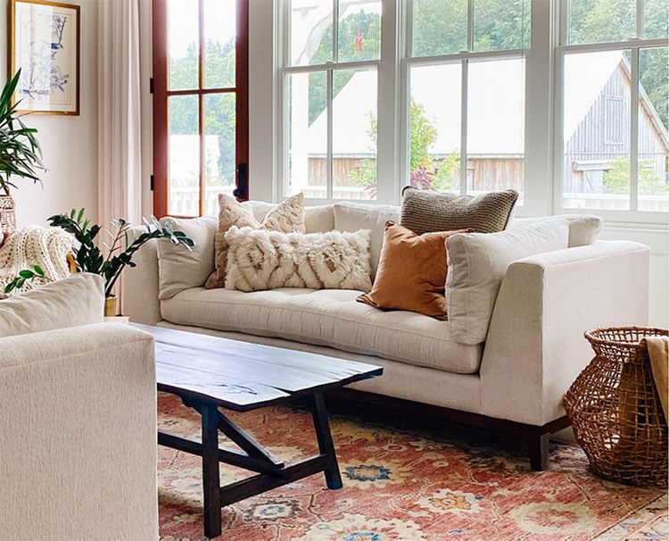 Living room with white sofa, textured pillows