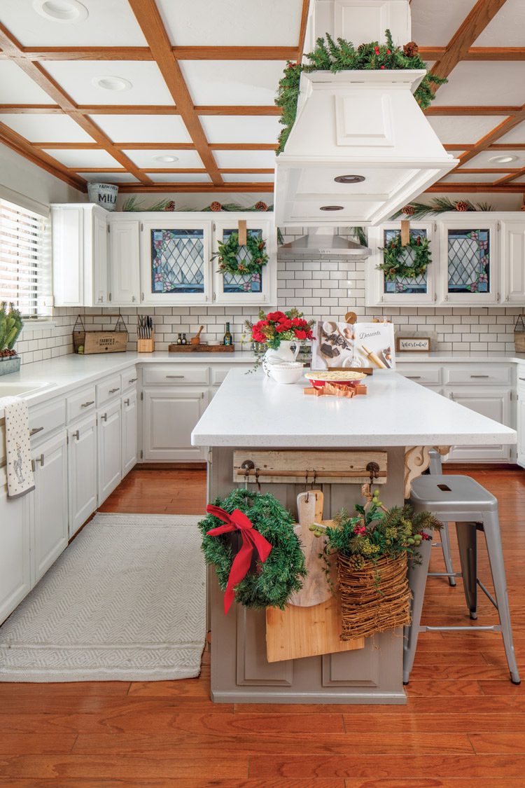 kitchen with garlands and Christmas greenery