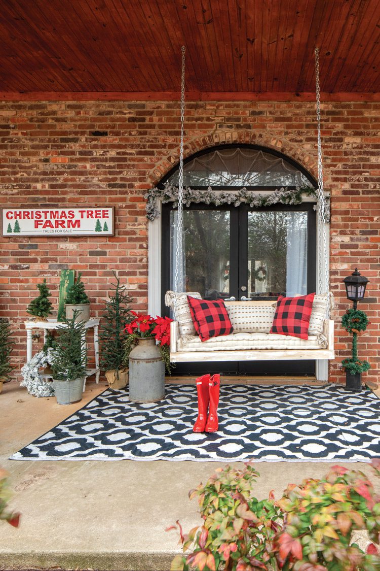 porch with potted Christmas trees